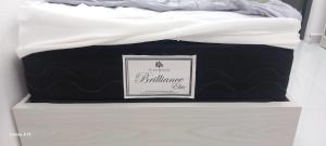 a black and white mattress sitting on top of a drawer at غزو 15 in Aydūn