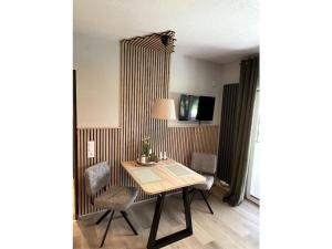 Μια τηλεόραση ή/και κέντρο ψυχαγωγίας στο Holiday apartment Has 26 APP links