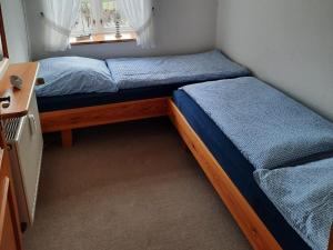 Giường trong phòng chung tại Friesenhaus Westerschütting