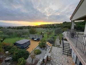 an aerial view of a backyard with a grill at Holiday home with 3 bedrooms in Ripenda Kras