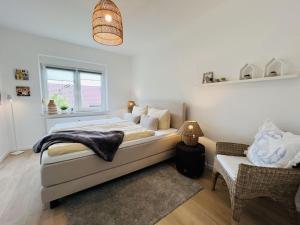 En eller flere senge i et værelse på Wattnflair Lütje Kaap