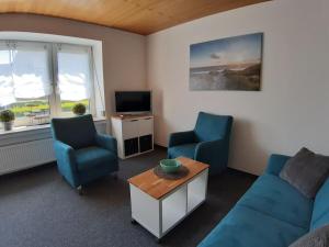 Μια τηλεόραση ή/και κέντρο ψυχαγωγίας στο Holiday apartment with 2 bedrooms