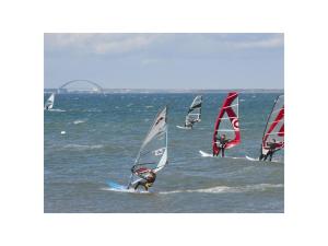 a group of people windsurfing in the ocean at The Linnebargs, House 2 in Bisdorf