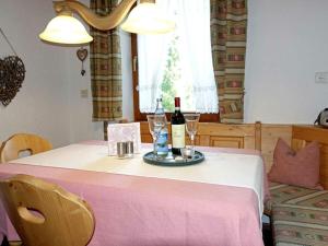 a table with two bottles of wine and glasses at Holiday apartment with 2 bedrooms in Akams