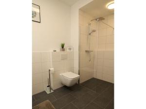 Ένα μπάνιο στο Holiday apartment in Emden with swimming pool +6 φωτογραφίες