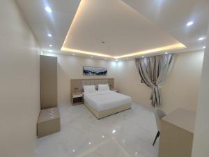 Postel nebo postele na pokoji v ubytování فندق الضيافة