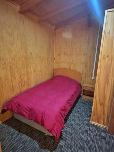 Ένα ή περισσότερα κρεβάτια σε δωμάτιο στο Cabañas Ross