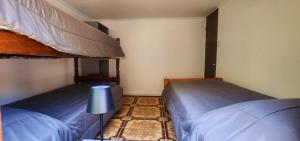 Ένα ή περισσότερα κρεβάτια σε δωμάτιο στο Cabaña El Hibisco