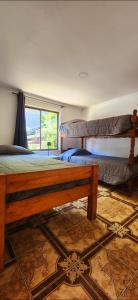 Ένα ή περισσότερα κρεβάτια σε δωμάτιο στο Cabaña El Hibisco