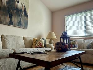 a living room with a couch and a coffee table at Sundance Retreat in Hemet
