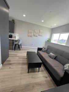 a living room with a couch and a table at Vacation home in Westminster
