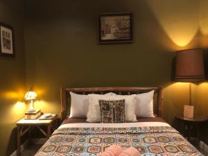 Ένα ή περισσότερα κρεβάτια σε δωμάτιο στο The Green Land Farm +52 φωτογραφίες