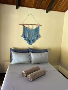 En eller flere senge i et værelse på Quintal dos buritis