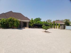a house with a courtyard with a tree in the middle at KumKum Apartments in Pakoto