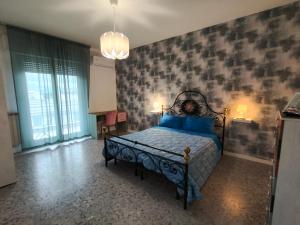 Ένα ή περισσότερα κρεβάτια σε δωμάτιο στο Attico Stadio