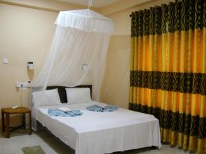 Letto o letti in una camera di Sigiri Lion Lodge