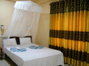 Letto o letti in una camera di Sigiri Lion Lodge