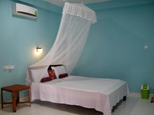 Letto o letti in una camera di Sigiri Lion Lodge