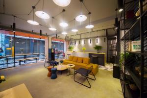 Posezení v ubytování Zhangjiajie Clamshell Youth Hotel