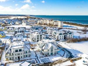 an aerial view of a city with snow covered houses at Dream holiday apartment with pool sauna MB in Börgerende-Rethwisch