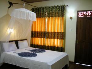 Letto o letti in una camera di Sigiri Lion Lodge