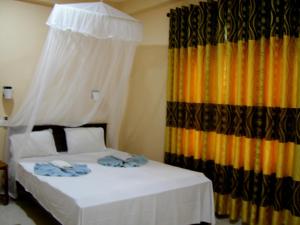 Letto o letti in una camera di Sigiri Lion Lodge