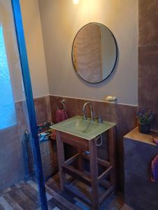 a bathroom with a sink and a mirror at Casa en Cobo-Parque Lago in Mar de Cobo
