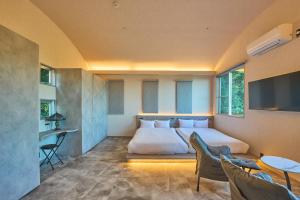 Ένα ή περισσότερα κρεβάτια σε δωμάτιο στο グラン熱川