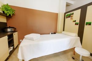 Postel nebo postele na pokoji v ubytování Hotel Rakovec