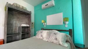 Giường trong phòng chung tại Apartamento Vista Mar até 4 hóspedes