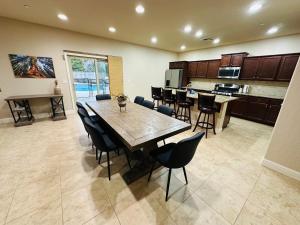 a kitchen and dining room with a table and chairs at Casa Cortez in Visalia