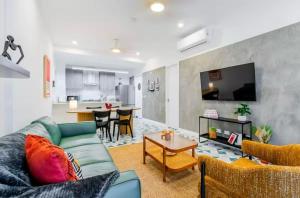 a living room with a couch and a table at Stunning 1BR in Santa Ana Best Area in Panama City