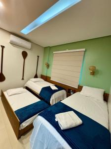 Ένα ή περισσότερα κρεβάτια σε δωμάτιο στο Flat Tapajós Alter 2 quartos, cozinha, climatizado, wifi 200mbps, estacionamento e self check-in +54 φωτογραφίες