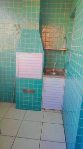 Et badeværelse på APARTAMENTO PRAIA GRANDE, Varanda Gourmet & Vaga de Garagem