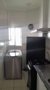 Køkken eller tekøkken på APARTAMENTO PRAIA GRANDE, Varanda Gourmet & Vaga de Garagem