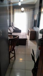 Et opholdsområde på APARTAMENTO PRAIA GRANDE, Varanda Gourmet & Vaga de Garagem