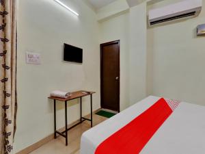 Ένα ή περισσότερα κρεβάτια σε δωμάτιο στο Hotel O SMS