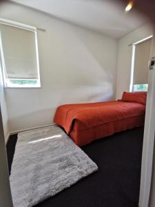 Ένα ή περισσότερα κρεβάτια σε δωμάτιο στο CHC Townhouse