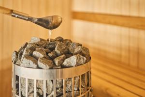 a metal bucket of food with a spoon at フレッチア in Futo