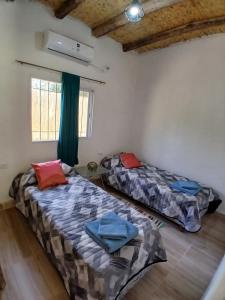 Ένα ή περισσότερα κρεβάτια σε δωμάτιο στο Kateké