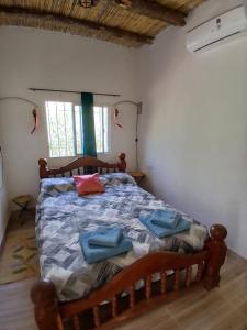 Ένα ή περισσότερα κρεβάτια σε δωμάτιο στο Kateké