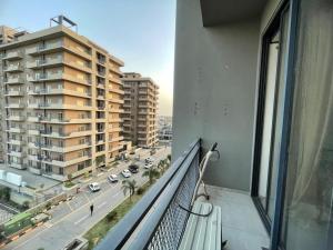 an apartment balcony with a view of a city street at Sunrise Villa in Islamabad