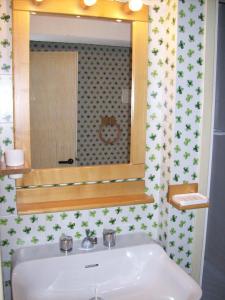 a bathroom with a sink and a mirror at Residence Portorotondo Tre in Porto Rotondo