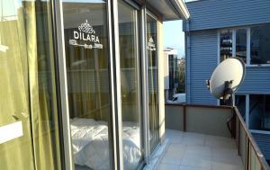 a glass window on the side of a building at Dilara Hotel Pansiyon in Antalya