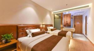 a hotel room with two beds and a window at James Joyce Coffetel Shijiazhuang the Mixc Jinyuan Tower Airport Bus in Shijiazhuang +231 photos