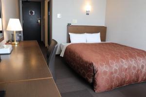 Ένα ή περισσότερα κρεβάτια σε δωμάτιο στο Castle Inn Toyokawa +40 φωτογραφίες