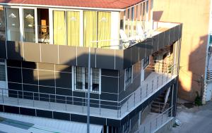 a building being constructed with black and white tile at Dilara Hotel Pansiyon in Antalya