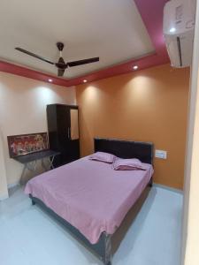 Ένα ή περισσότερα κρεβάτια σε δωμάτιο στο MTDC Shivtej