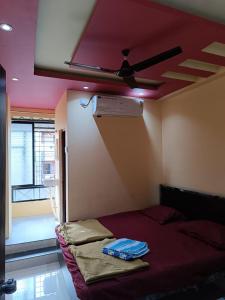 Ένα ή περισσότερα κρεβάτια σε δωμάτιο στο MTDC Shivtej