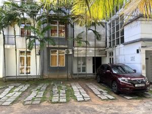 a car parked in front of a building at Prime Residencies Panadura - Convenient Apartment in Panadura